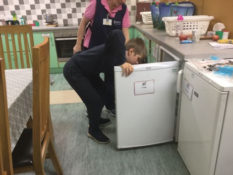 Delivering the milk to each classroom.