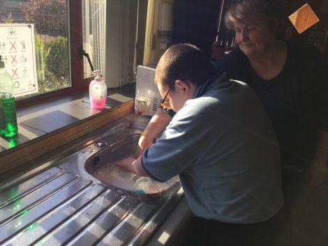 Washing the dishes after break.