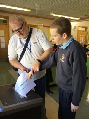 Assisting the office staff by using the shredder.